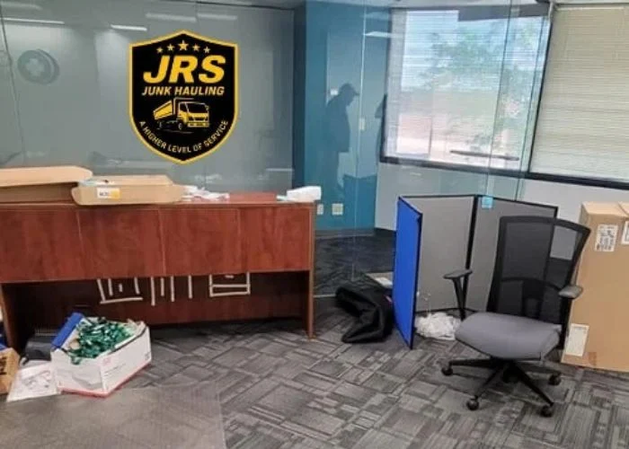Office furniture and boxes gathered for a commercial cleanout
