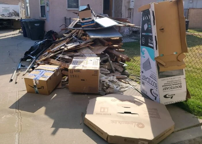 Boxes and discarded materials outside a property