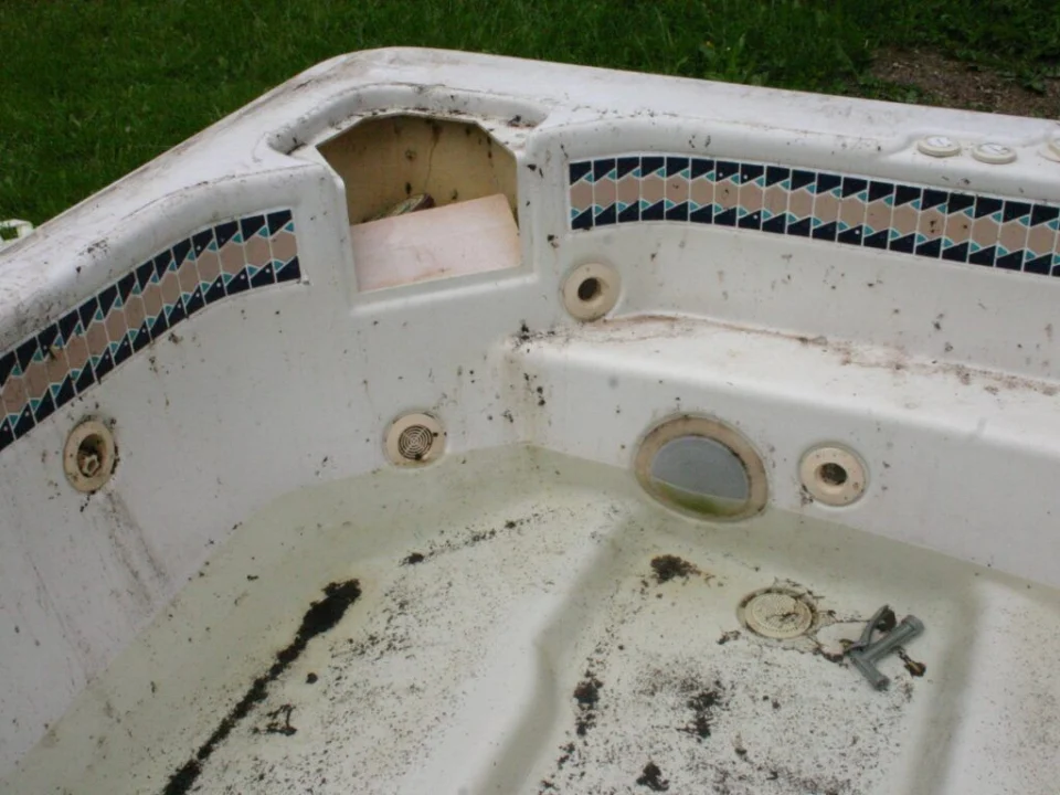 An old outdoor hot tub awaiting removal