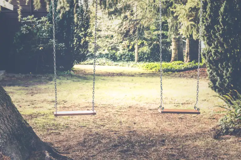 An outdoor swing set in a playground