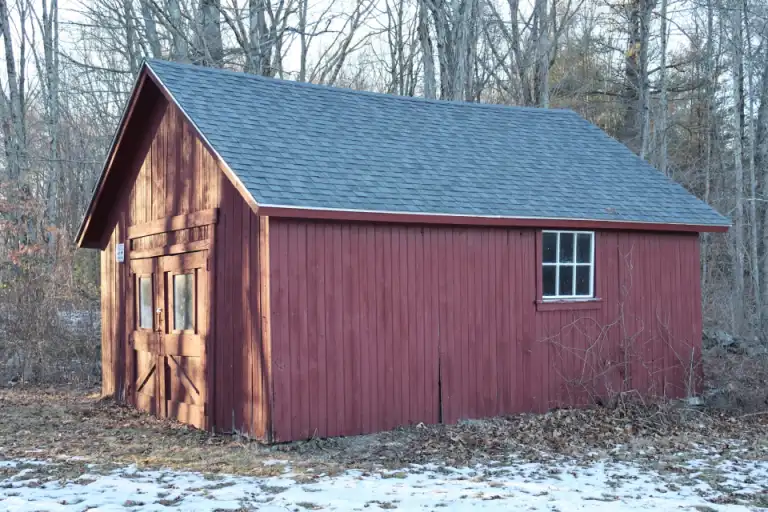A small wooden storage shed
